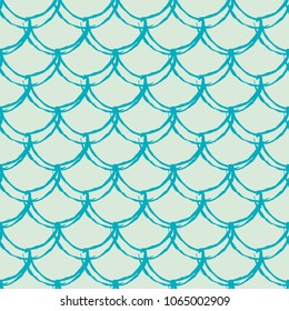 Fish scale seamless pattern. Reptile, dragon skin texture. Tillable background for your fabric, textile design, wrapping paper, swimwear or wallpaper. Blue mermaid tail with fish scale underwater.