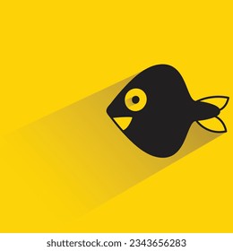 fish with shadow on yellow background