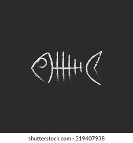 Fish skeleton hand drawn in chalk on a blackboard vector white icon isolated on a black background.