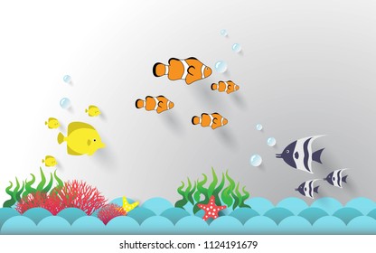  Fish are swimming in the sea. Paper cut art and craft style. And have starfish on the ocean waves.