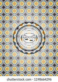 fishbowl with fish icon inside arabic badge background. Arabesque decoration.