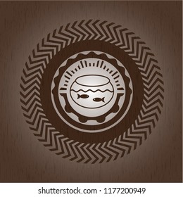 fishbowl with fish icon inside badge with wood background