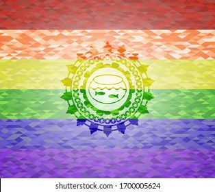 fishbowl with fish icon inside emblem on mosaic background with the colors of the LGBT flag