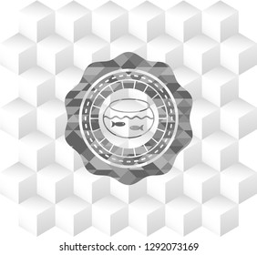 fishbowl with fish icon inside grey emblem with cube white background