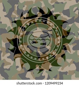 fishbowl with fish icon on camo pattern