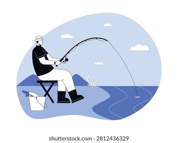 A fisherman sits on a folding stool by the water's edge, reeling in a fish with a bucket next to him.
