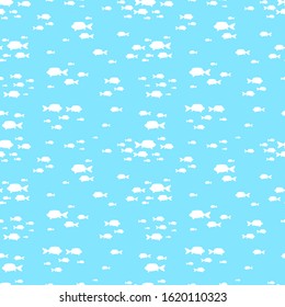 Fishes pattern. Sea or ocean background. School of fish silhouettes on blue vector seamless texture