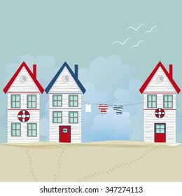 Fishing house, tiny white house, and vast sky with seagulls. Footsteps in the sand