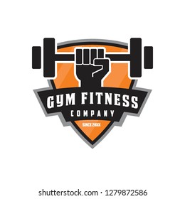 fist arm hand lift barbell gym fitness crossfit company team club emblem badge in shield shape logo icon vector template