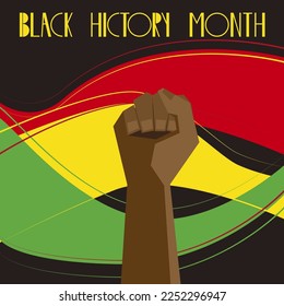 The fist on a black background with green, red and yellow waves. Black history month.