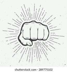 Fist with sunbursts in vintage style. Vector illustration