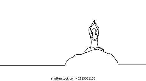 fit woman doing yoga sitting outside on rock