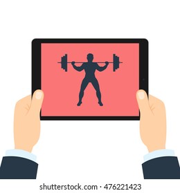 Fitness app for tablet. Weightlifter with barbell. Hands holding tablet. Bodybuilding app.