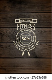 Fitness club badges logos and labels for any use, on wooden background texture