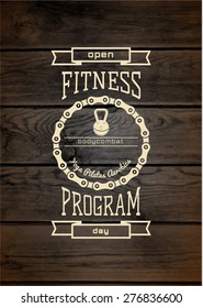 Fitness club badges logos and labels for any use, on wooden background texture