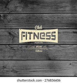 Fitness club badges logos and labels for any use, on wooden background texture