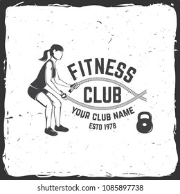 Fitness club. Vector. Concept for shirt or print, stamp, patch or tee. For fitness centers emblems, gym signs and others related health and gym business. Girl doing exercise with battle ropes.