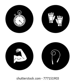 Fitness glyph icons set. Sport equipment. Jump rope, bicep muscle, fingerless gym gloves, stopwatch. Vector white silhouettes illustrations in black circles