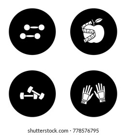 Fitness glyph icons set. Sport equipment. Dumbbells, gym gloves, apple with measuring tape. Vector white silhouettes illustrations in black circles