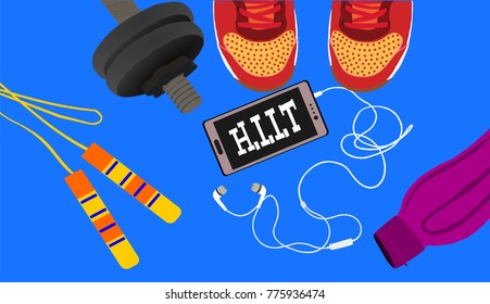 Fitness, healthy and active lifestyles concept. Dumbbells,skipping rope, sport shoes, smart phone with earphone and water bottle on blue background with word hiit (high intensity interval training)