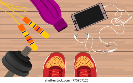 Fitness, healthy and active lifestyles concept. Dumbbells, skipping rope, sport shoes, smart phone with earphone and water bottle on wooden gym floor
