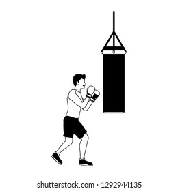 Fitness man practicing boxing in black and white