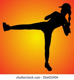 fitness woman giving kick- isolated on white