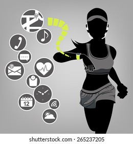 Fitness woman looking at smart watch touchscreen and app icons.