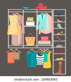 A Fitted Wardrobe filled with womans clothes,shoes,handbags