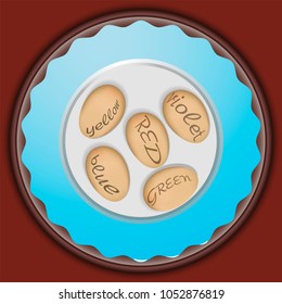 Five eggs with the name of the color on a blue plate.