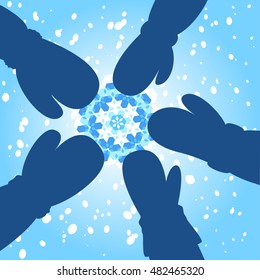 Five gloved hands touching a snowflake Christmas greeting card design on a cold blue background with falling winter snow, vector illustration