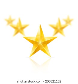 Five gold stars on white background - the first one in focus, the others blurry.