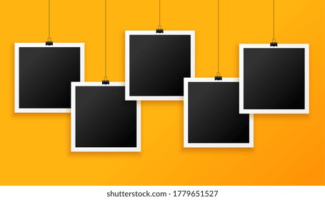 five hanging photo frames on yellow background