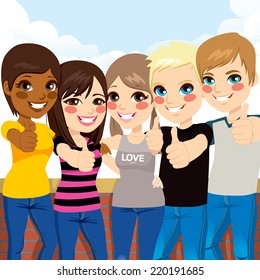 Five happy young teenagers standing and making thumbs up gesture in front of wall and sky background