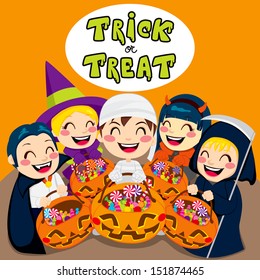 Five kids saying trick or treat with Halloween pumpkin bags full of sweets and candy