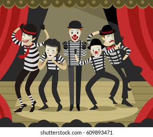 five mime clowns playing actors in theater stage