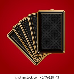 Five poker playing cards on red background. Black and gold back side design