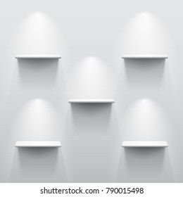 Five shelves on the wall with light and shadow in empty white room.