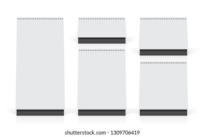 five white calendars stand on the table mock up vector