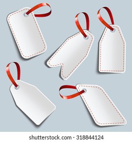 five white label with red ribbons