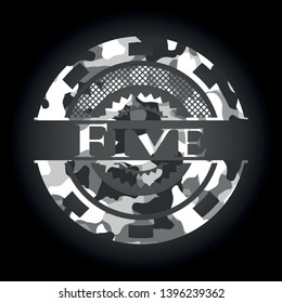Five written on a grey camouflage texture