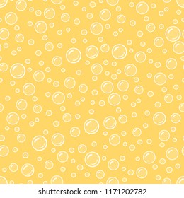 Fizzy yellow drink cartoon bubbles in a beer, seamless pattern, vector