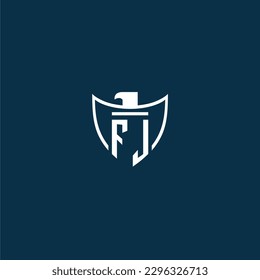 FJ initial monogram logo for shield with eagle image vector design