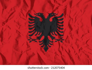 Flag of Albania on wrinkled paper vector illustration.