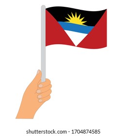 Flagge von Antigua und Barbuda    . Hand, die eine Flagge von Antigua und Barbuda hält - Vektorillustration Symbol.