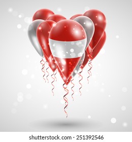 flag of Austria on air balls in heart-shaped. Celebration and gifts. Ribbon in the colors are twisted under the balloon. Independence Day. Balloons on the feast of the national