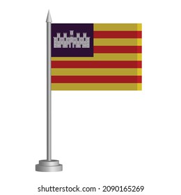 Flag of Balearic Islands of Spain flying on a flagpole stands on the table. Vector illustration