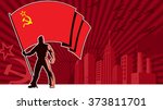 Flag bearer holding the flag of USSR over grunge background with copy space. 