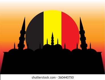 Flag of Belgium on the sunset background with a mosque on it