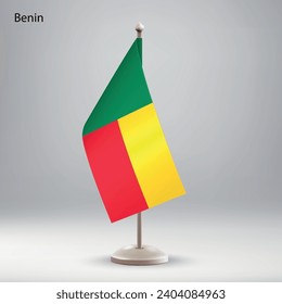 Flag of Benin hanging on a flag stand. Usable for summit or conference presentaiton